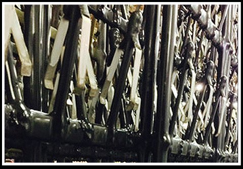 A rack of masked tooling on the plating line
